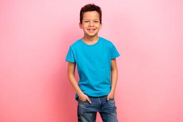 Photo portrait of pretty schoolboy hands pockets promo shopping dressed stylish blue outfit isolated on pink color background