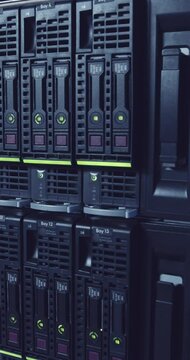 Vertical video of a large computer server room in a data center