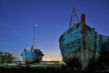Wooden fishing boats on dry dock in Vietnam