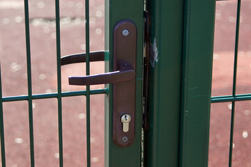 The door handle of the door to the sports field