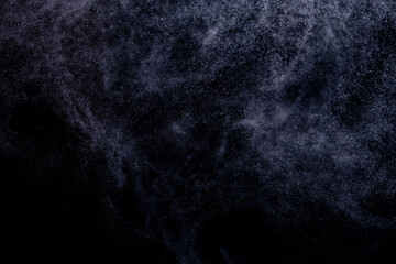 small drops of rain, snow on a black background. wind. Natural background