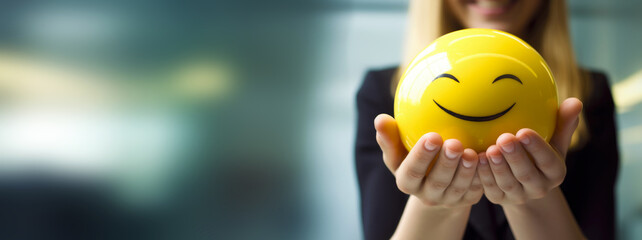 mental health positive thinking and attitude, mental wellness in office work environment between staff colleague co-workers, abstract background banner with woman female holding happy smile ball