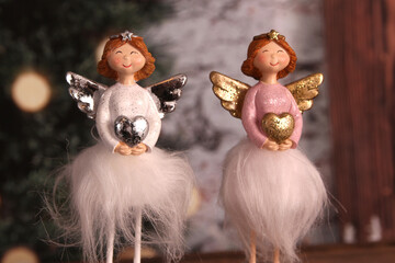 angels with glitter holding heart christmas decoration