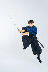ジャンプして日本刀を振る少年　サムライ　武道（切り抜き背景透過PNGも販売しております。作成者リンクから「PNG」で検索してください）