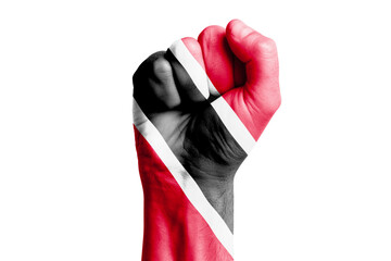 Man hand fist of TRINIDAD flag painted. Close-up.