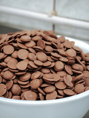 Milk brown chocolate drops close up