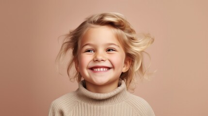A blond boy exudes happiness against a calming beige canvas.