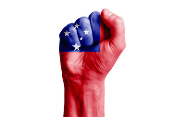 Man hand fist of SAMOA flag painted. Close-up.