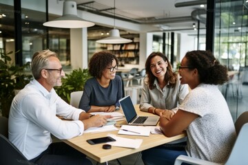 Cheerful design professionals having a meeting in an office
