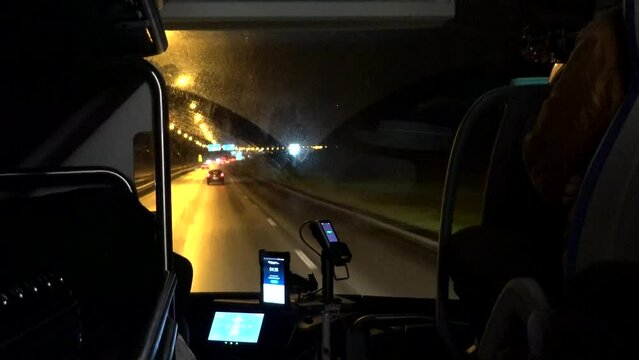 Stockholm, Sweden A view of the E4 highway at night from the inside of the Flygbussarna airport transfer bus.  