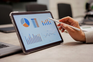 close up  employee man check performance and summary report of company at office board room for business and industry concept