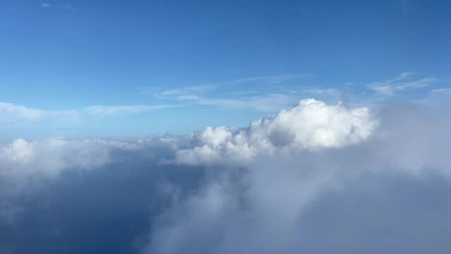 Aerial view flying over Formentera island view through the clouds