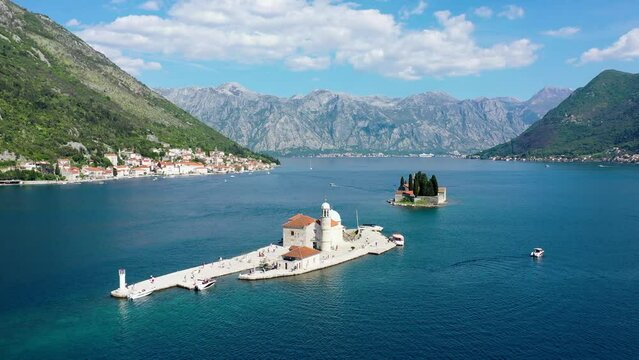 Saint George Island and Church of Our Lady of the Rocks in Perast, Montenegro. Our Lady of the Rock island and Church in Perast on shore of Boka Kotor bay (Boka Kotorska), Montenegro, Europe.