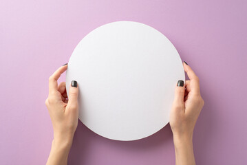 Art of promotion: Gracing scene, my black-manicured hands reveal a white circular frame on a lilac backdrop. From first person top view, captivating space for text or adverts, designed with finesse - obrazy, fototapety, plakaty