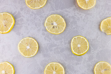 Diagonally Arranged Fresh Lemon Slices for a Background. flat lay photo.