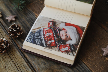 Christmas printed photos in picture album. Photo printing concept. 