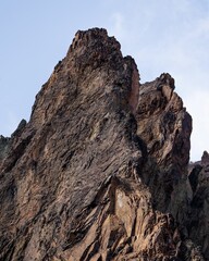 Landscape with a rocky mountain side with a clear blue sky