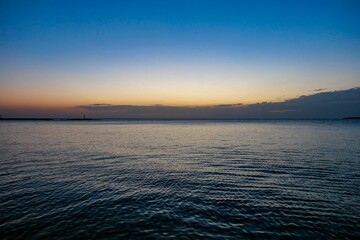 Obraz premium Scenic view of sunset on ocean waves in Porec, Istria, Croatia