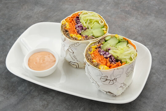 Salad Wrap. Tortilla Wraps With Beef Teriyaki And Fresh Vegetables. Served With Mayonnaise Sauce
