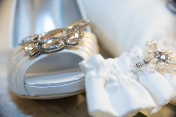 there is a pair of shoes with wedding garters