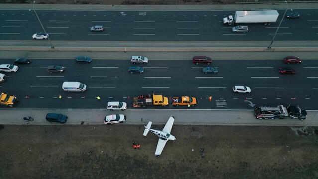 Emergency airplane landing on highway. Top Drone shot