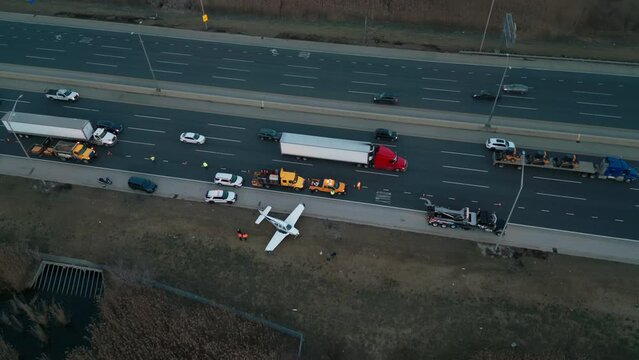 Top Wide aerial shot of Emergency airplane landing on highway. 