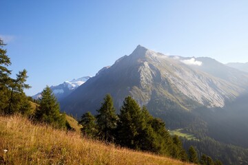 Beautiful landscape of the bog mountains with sharp peaks against the sunny blue sky