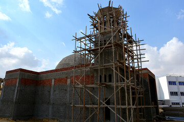 A new mosque under construction, building a new grand Masjid mosque in Cairo, Egypt, with a big...