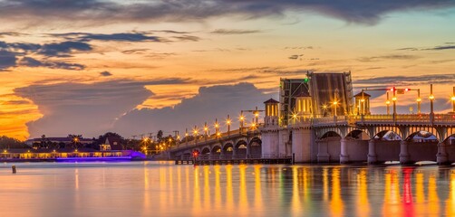 Fototapeta na wymiar Golden sunrise over the bridge of Lions St. Augustine