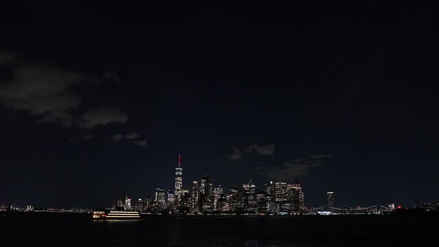New York skyline during the night. 4K video with the iconic skyline landscape of Manhattan during the night, filmed from ferry. Travel to America.