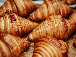 Fresh baked croissants. Warm fresh croissants with crispy crust closeup