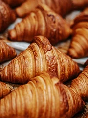 Fotobehang Bakkerij Fresh baked croissants. Warm fresh croissants with crispy crust closeup  © by Natallia