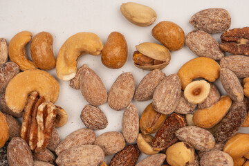 A group of almonds, pistachios, walnuts, macadamia, cashews.