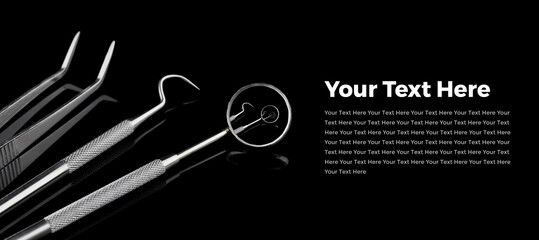 Dental tools on black. Dental tools on black shiny background with copy space and example text.