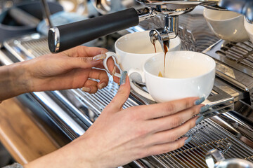 Barista coffee service concept.Barista women using coffee machine to make coffee in cafe