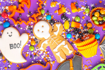 Bright colorful Halloween gingerbread cookies and sweet background. Homemade biscuits with cookie...