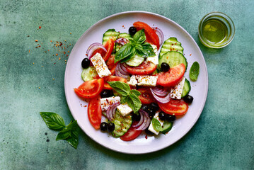 Traditional fresh vegetable greek salad. Top view with copy space.