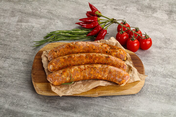 Raw sausages with spices and herbs