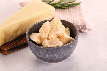 Chopped Italian hard parmesan cheese