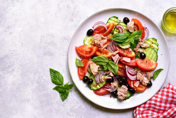 Fresh vegetable salad with tuna. Top view with copy space.