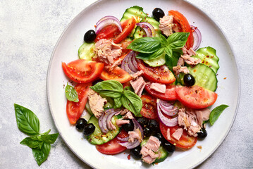 Fresh vegetable salad with tuna. Top view with copy space.