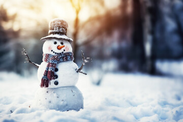 Obraz premium Snowman with carrot nose, scarf and hat on snow in winter
