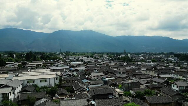 Drone Shot View of an Old Chinese Baisha Village with  Mountains 4K