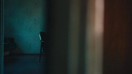 Crazy woman in nightgown writhing in armchair possessed by evil spirit, exorcism