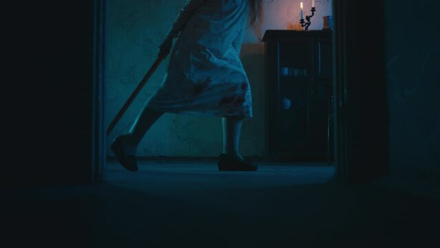 Crazy zombie killer walking in abandoned house, pulling sledgehammer, nightmare