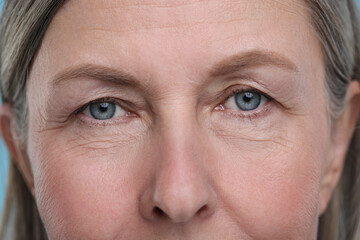 Fototapeta premium Closeup view of senior woman's face with aging skin