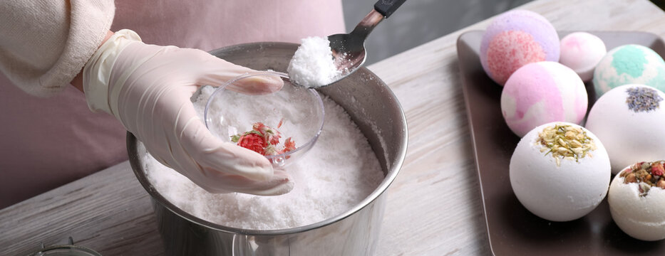 Woman making bath bomb at table, closeup. Banner design
