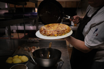 cooking Spanish traditional omelet tortilla