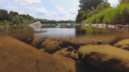 Fototapeta premium Underwater Shot of Rocky River Bottom on Sunny Day