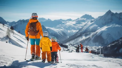 Fotobehang Family enjoying winter time at a ski resort © Nataliia